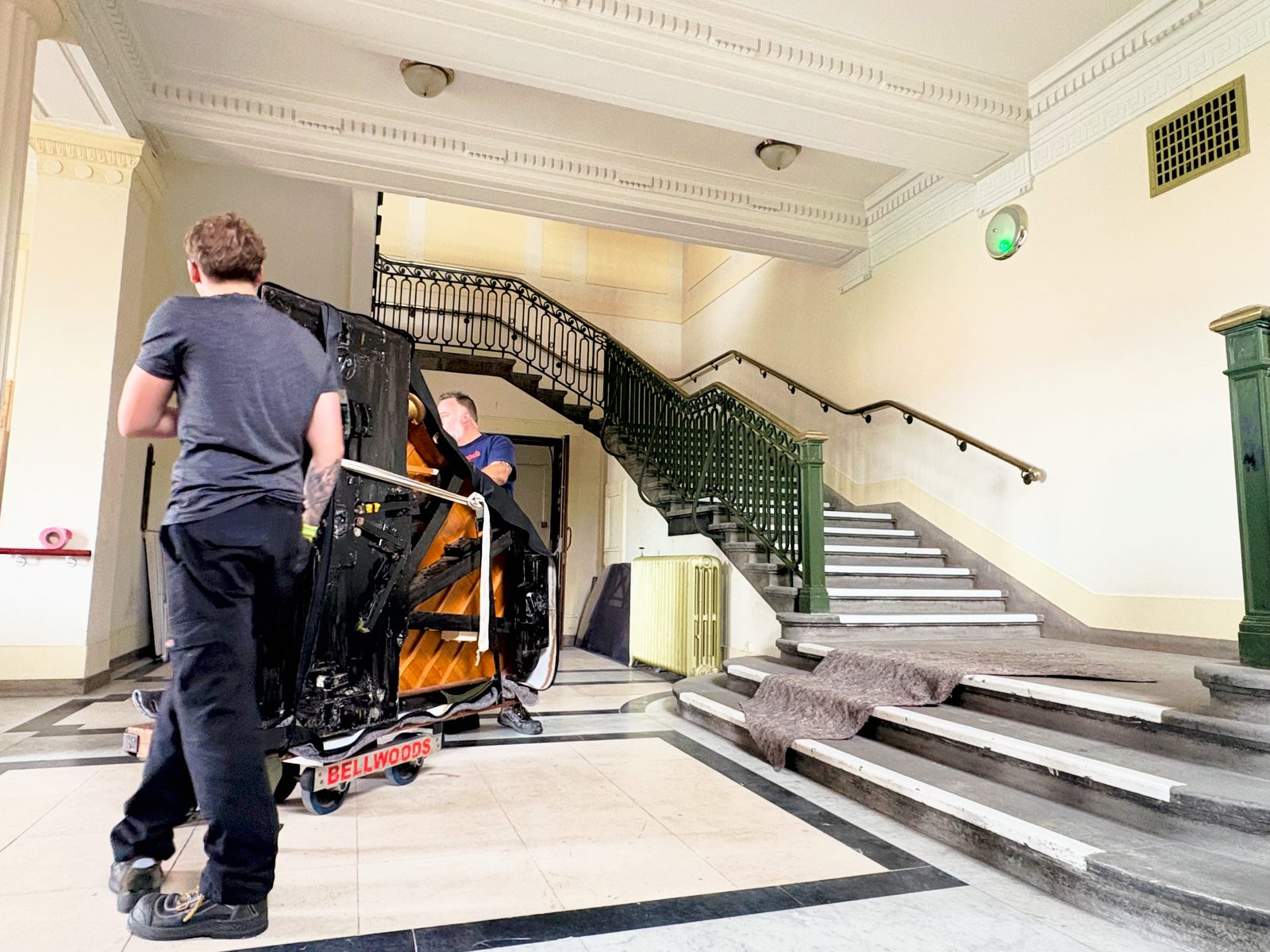 Steinway Model A grand piano on its side on a Bellwoods piano skate at the foot of the staircase to the Civic Hall at Wallasey Town Hall