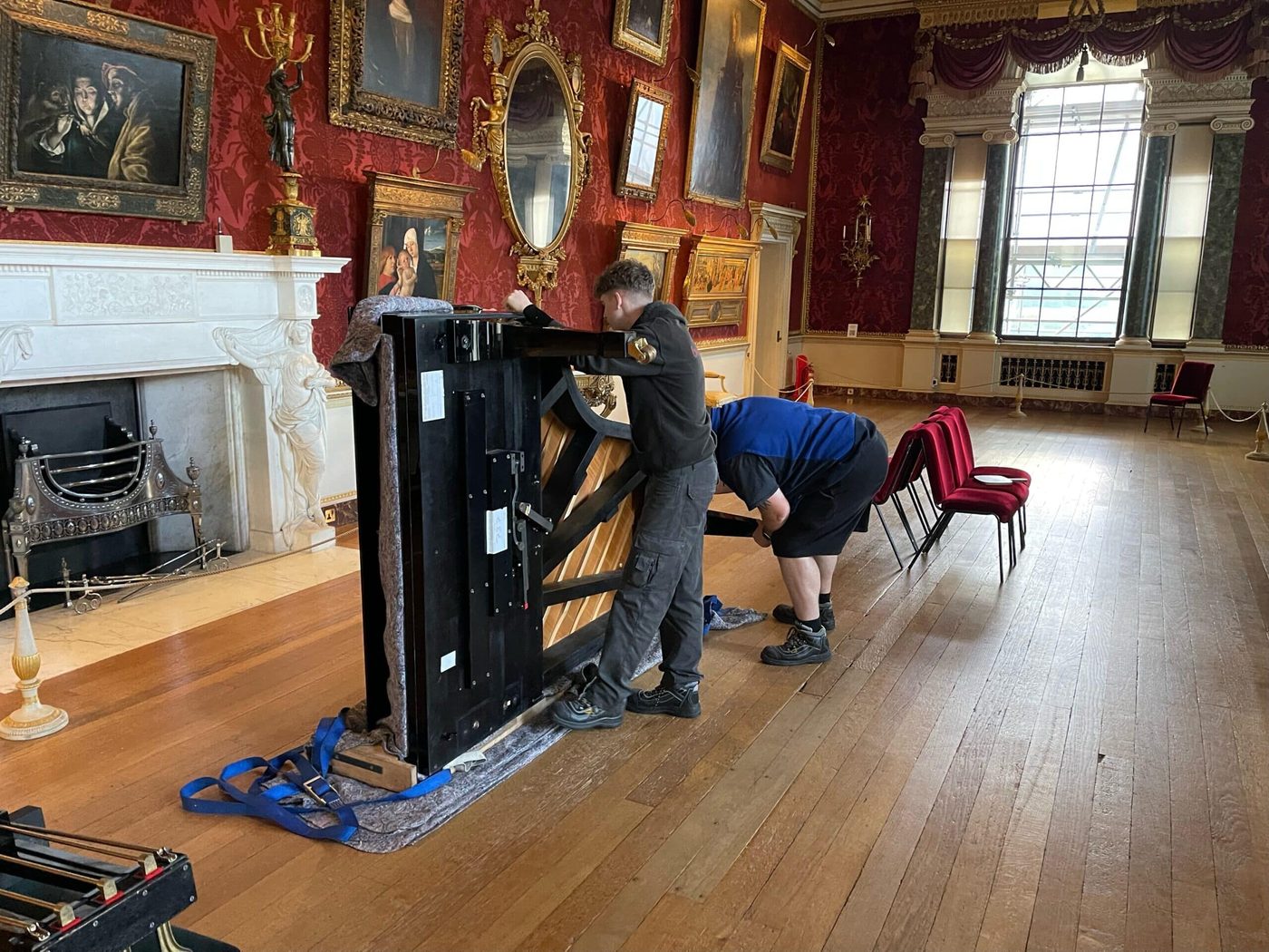 Bellwoods moving a grand piano in a grand room